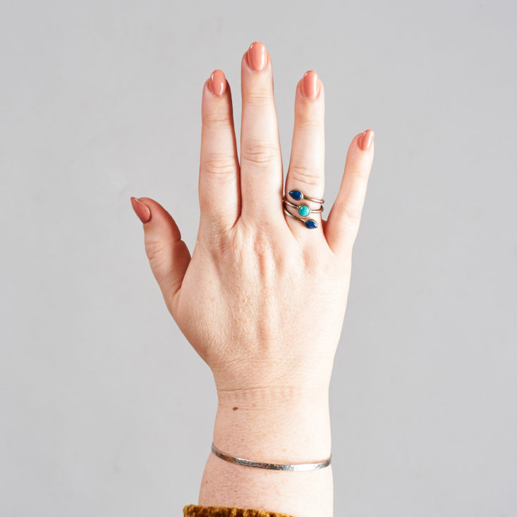 megans hand with ring and bangle